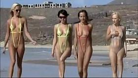 Four hot babes in tiny swimsuits at beach