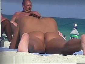 Naked tanned pussies acting horny at the beach