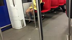 Sexy brunette upskirted in metro sairs