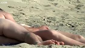 Playing with his wife on the beach gets him a blowjob