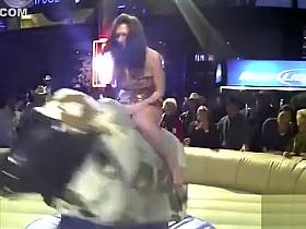 Hottie rides the bull while everyone sees her undies