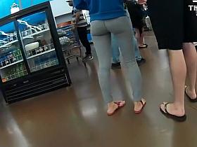 Nice ass girl in gray leggings at the supermarket