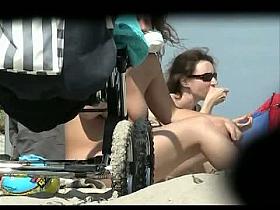 Beach nudist voyeur video of a milf with huge tits flashing it all in public