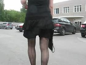 Girl in seamed stockings in a windy day 2