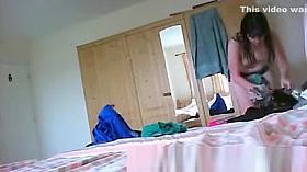 Wet woman dressing in bedroom