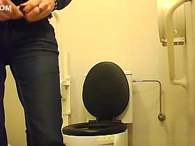 Woman squats over toilet to pee