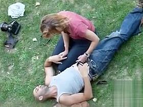 Voyeur handjob video of German lovers in the grass