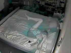 Hidden cam catches mom fingering on bed.