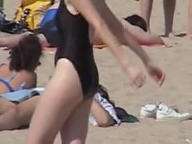 Amateur in black swimsuit on the candid beach voyeur video 07z