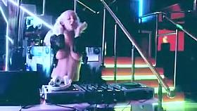 Busty DJ plays stylish music with nude tits