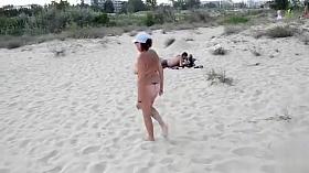 Exhibitionist wife is naked on the sandy beach