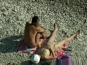 Nudist woman wanks her nude man's penis