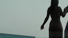 This beautiful nudist woman was sunbathing on a nude beach
