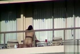 Couple has public sex on a hotel balcony