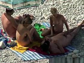 Two nudist couples spied in the beach