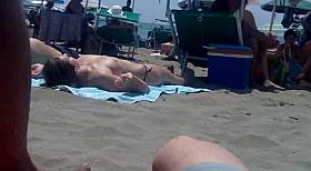 girl in topless in the beach