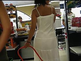 Thong peeks through her white dress