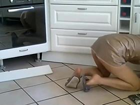 Housewife cleaning floor without panties