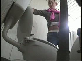 Alluring blond woman caught pissing
