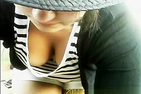 Girl in white and black stripes top cleavage