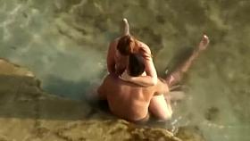 Guy gets an amazing blowjob in the shallow water