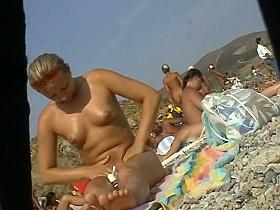 eastern European perfect ass oiling herself up naked on the beach