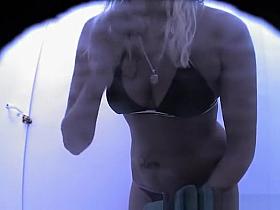 Blonde dressing her g string bikini bottom