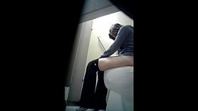 Cute Girl Sits Down on the Toilet