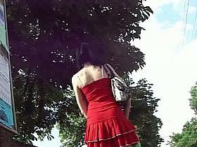 Cute brunette in red dress upskirt