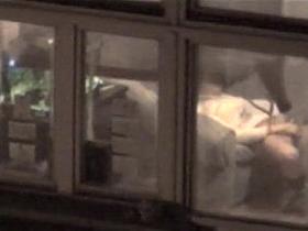 Lovely babe filmed masturbating through apartment window