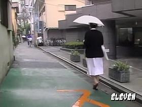 Shy oriental nurse getting pulled into some rainy sharking scene