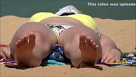 Tanned stunner has her crotch recorded while sunbathing