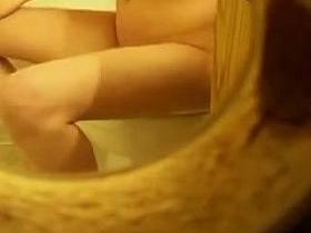 Naked girl with full boobs pissing on toilet getting spied