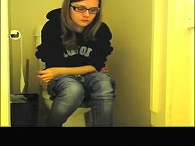 Girl with glasses seat and pee