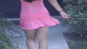 Sexy walk in a pink skirt.