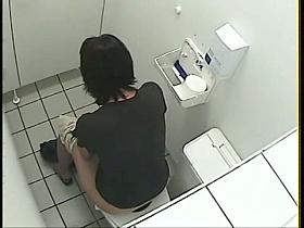 A pissing girl is exposed to a toilet voyeur cam