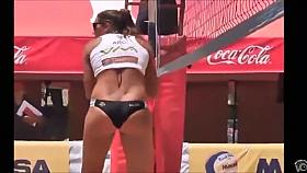 Beach volleyball girls with athletic asses in bikini bottoms