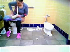 Chubby woman spied in public toilet peeing