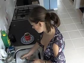 Spy her boobs while she does the dishes