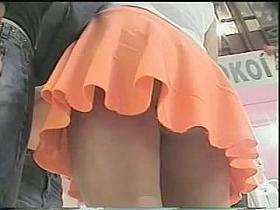 Upskirts video of a cute girl in an orange skirt