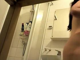 Teen taking shower in bathroom
