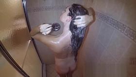 Amateur pornstar washing hair and body in the shower while you watch