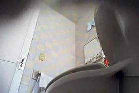 Cute maid piddles on a hidden camera