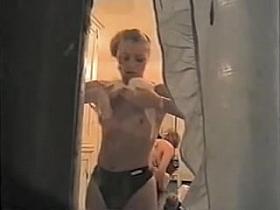 Tan lined girl wears lingerie on window voyeur clip