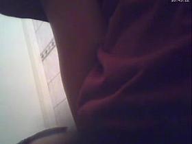 Brunette teen visiting toilet hidden cam voyeur