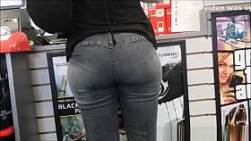 Tight jeans woman buying games