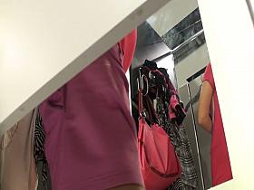 Girl in a dressing room gets long legs and upskirt spied