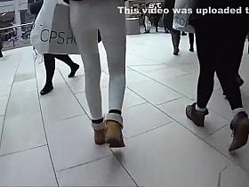 Girls in tight jeans pants walking in the street