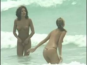 Hot nude woman having fun on a hot beach video