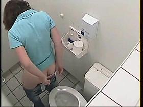Girl pissing on toilet sitting on bowl back to the cam